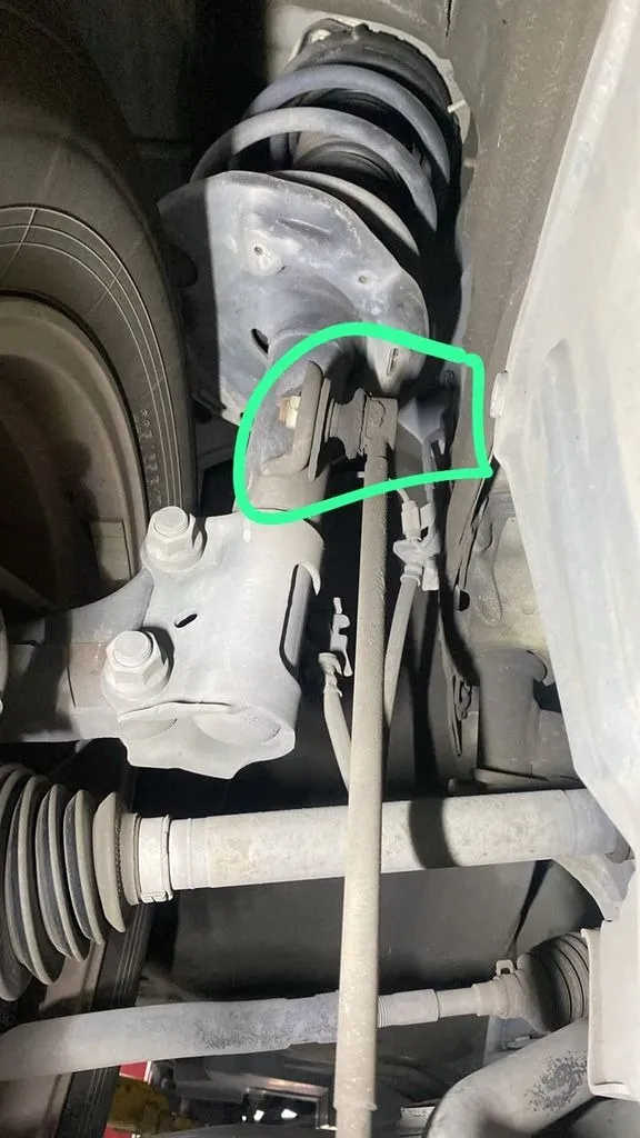 Toyota Harrier front stabilizer link circled in green during a suspension inspection