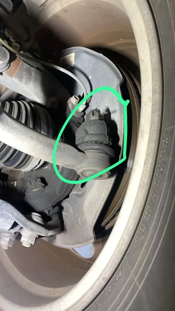 Toyota Harrier tie rod end circled in green during an inspection