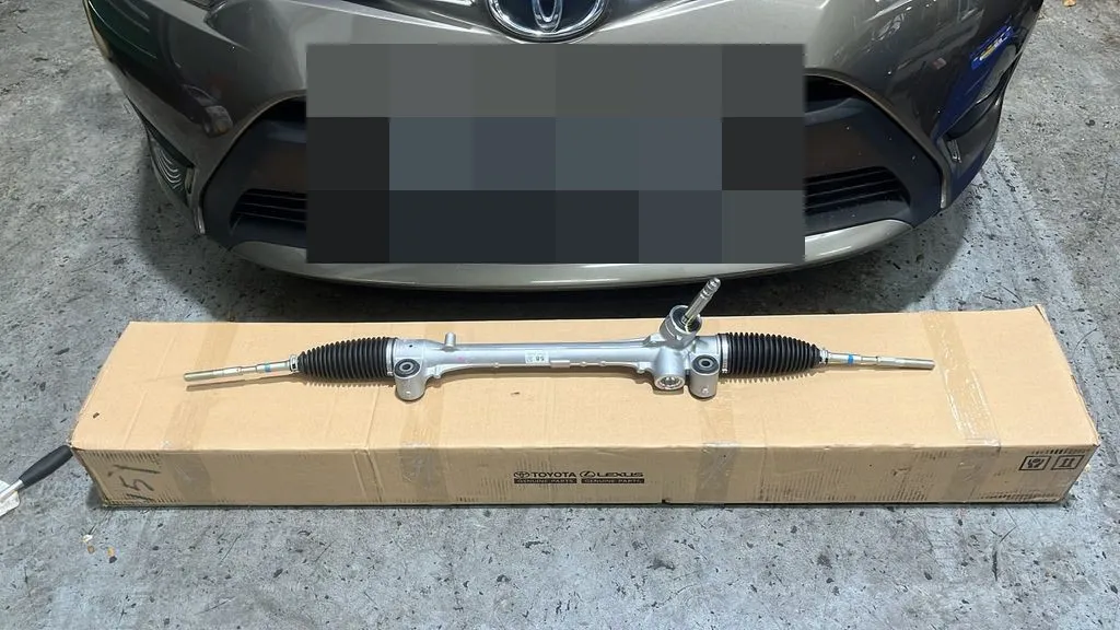 New Toyota Vios steering rack on its Toyota genuine parts box in front of the car at our Singapore workshop