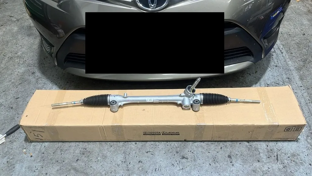 New Toyota Vios steering rack on its Toyota genuine parts box in front of the car at our Singapore workshop