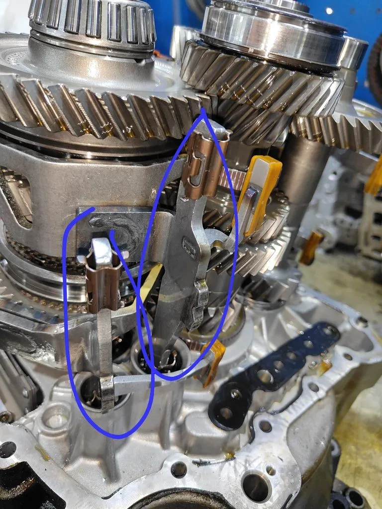 Cracked shift bracket inside the VW Golf GTI manual gearbox, with the crack annotated, found during our strip-down in Singapore