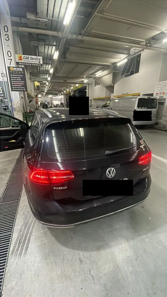 Black Volkswagen Passat estate at our Singapore workshop for ABS and ESP warning-light diagnosis