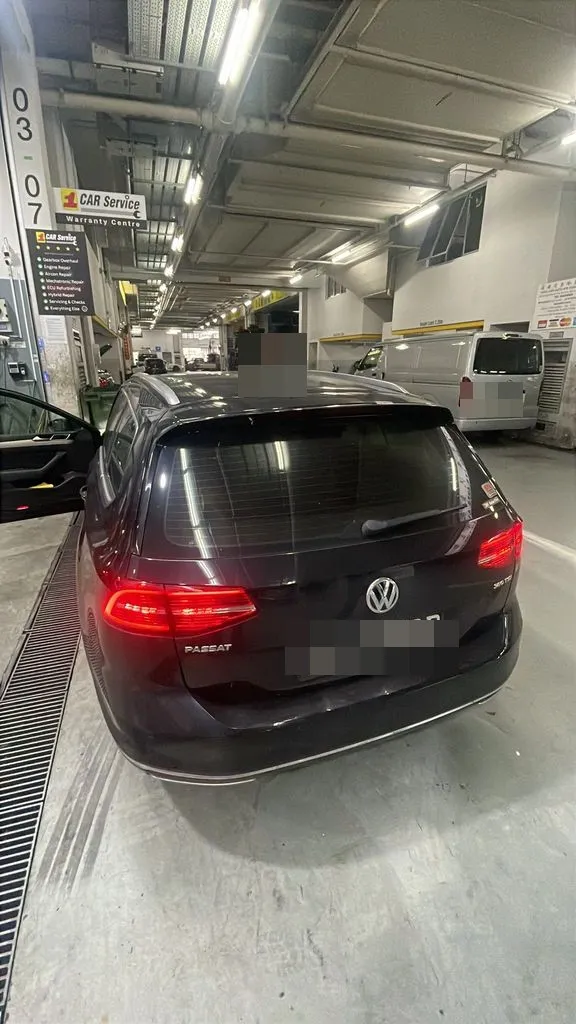 Black Volkswagen Passat estate at our Singapore workshop for ABS and ESP warning-light diagnosis