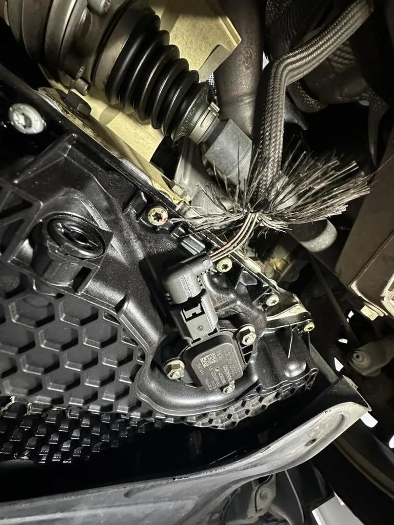 ABS wheel-speed sensor and wiring on a Volkswagen Passat identified during ODIS diagnosis in Singapore