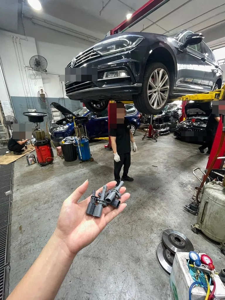 Old ABS wheel-speed sensors removed from a Volkswagen Passat during replacement at our Singapore workshop