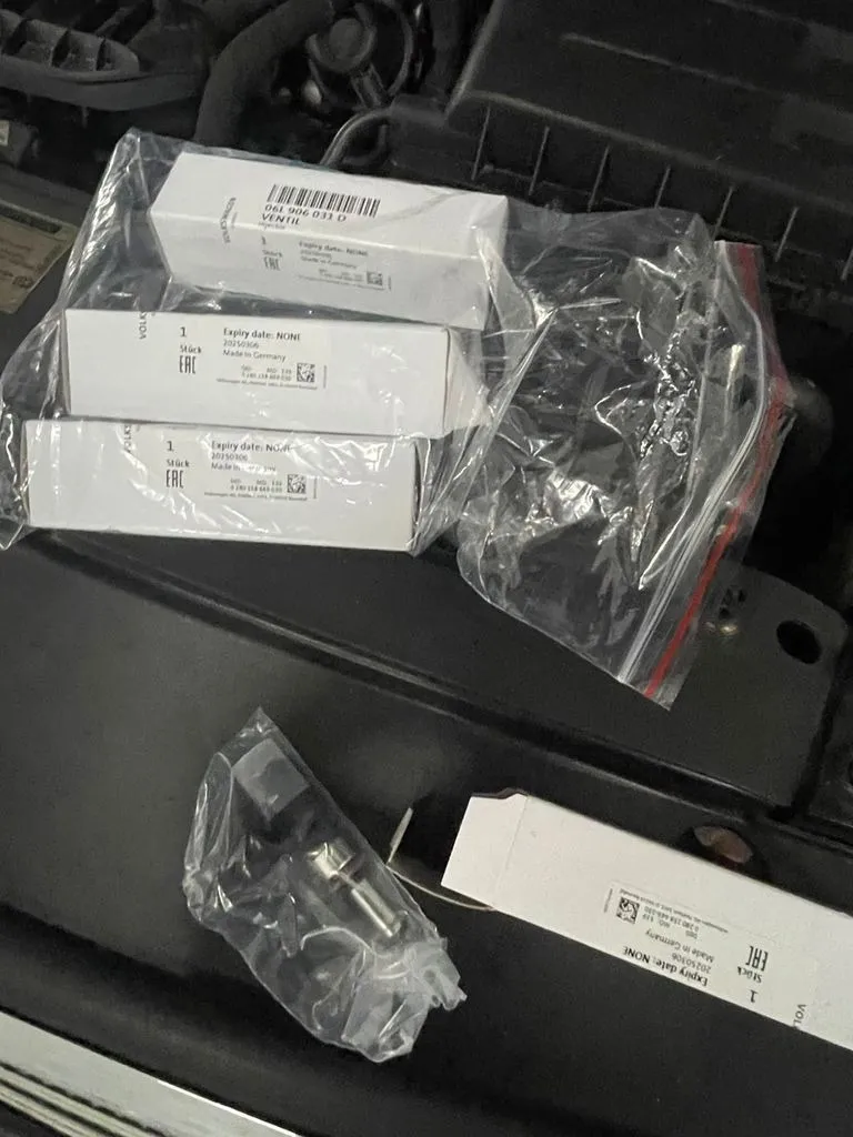 Fuel injectors removed from a VW Passat laid out for inspection and cleaning at our Singapore workshop