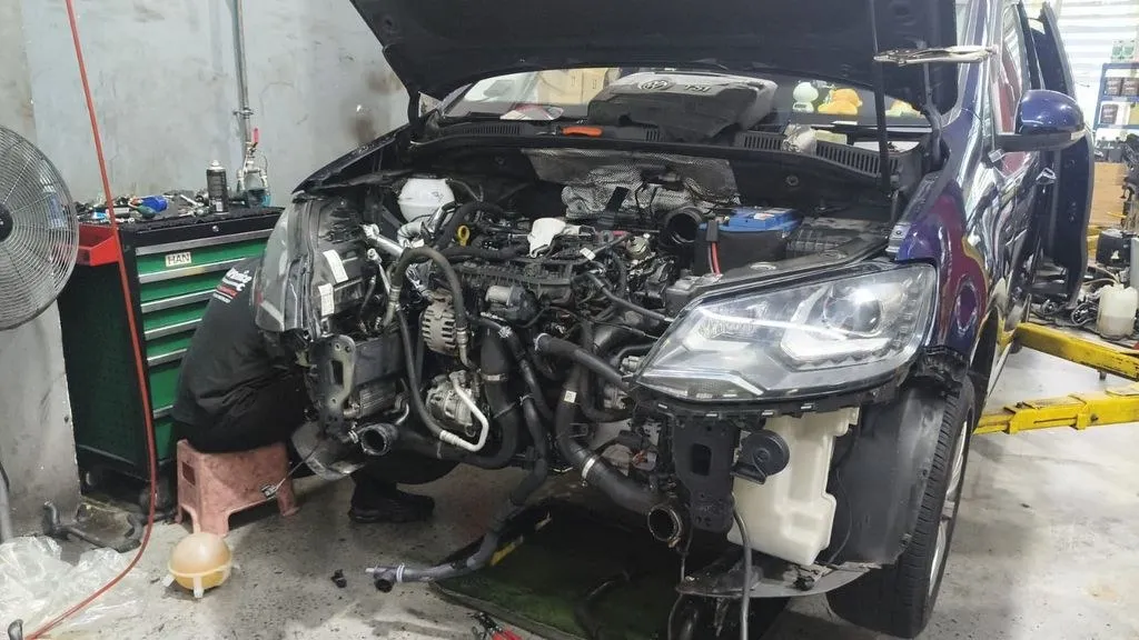 Engine bay of a car during a cooling system diagnosis at our Singapore workshop