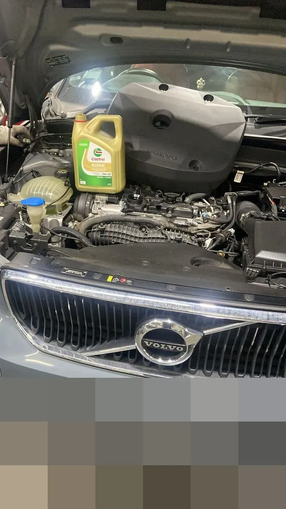 Volvo engine bay during a major service at our Singapore workshop with the oil change in progress