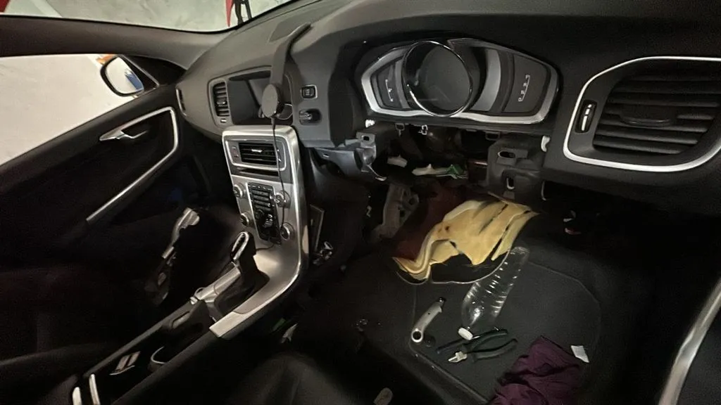 Volvo V60 dashboard removed to access the evaporator coil during an aircon repair in Singapore