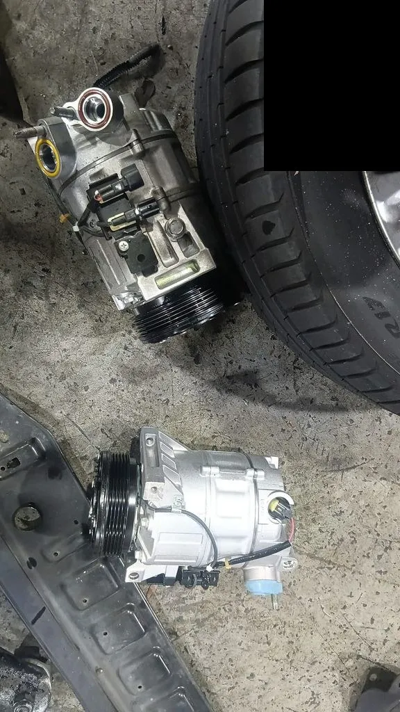 Old and new aircon compressors for a Volvo V70 at our Singapore workshop
