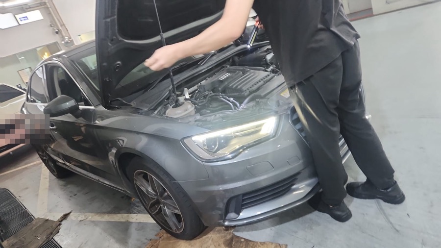 Our technician inspecting an Audi A3 engine at our Singapore workshop
