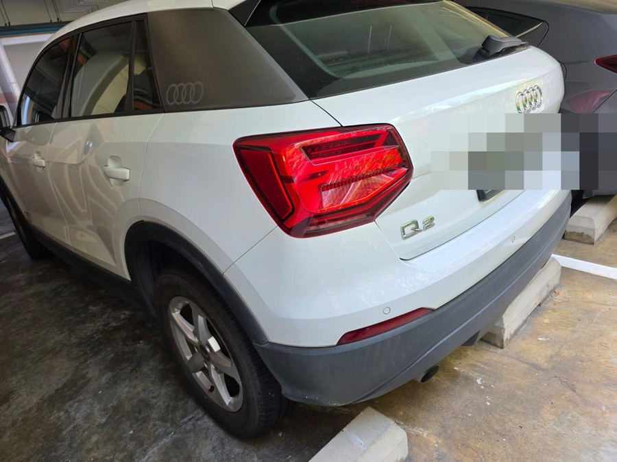 White Audi Q2 SUV parked at our Singapore workshop