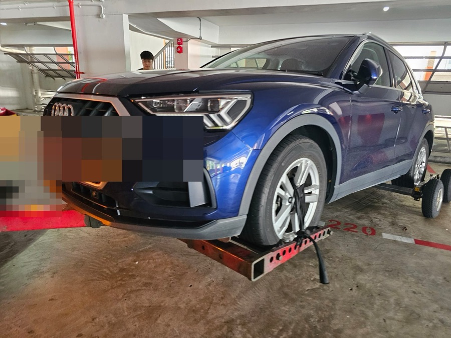 Audi Q3 arriving at our Singapore workshop on a tow dolly.