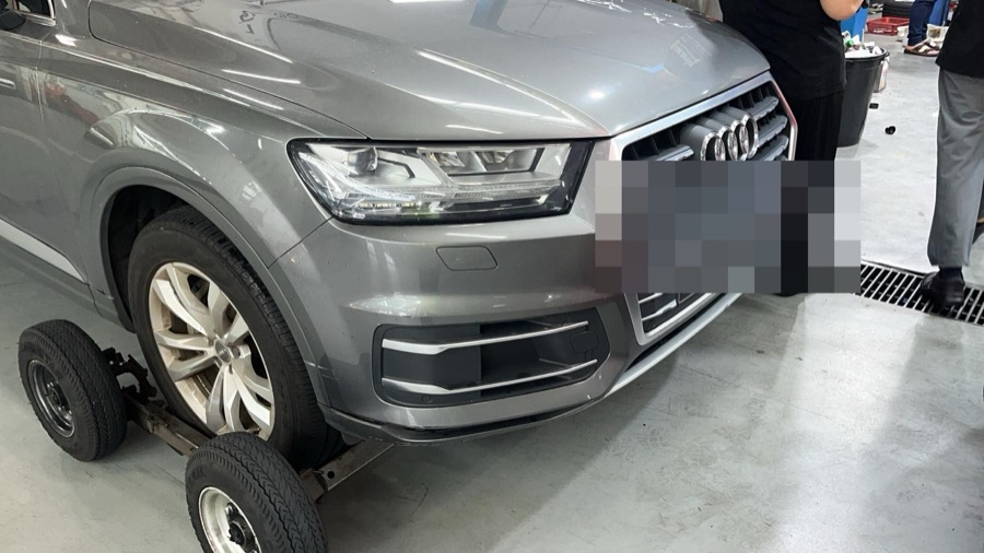 Audi Q7 SUV on a tow dolly at our Singapore workshop