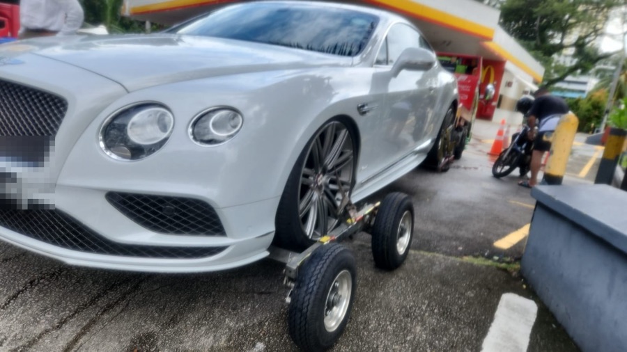 Bentley Continental GT being towed in for repair at our Singapore workshop.
