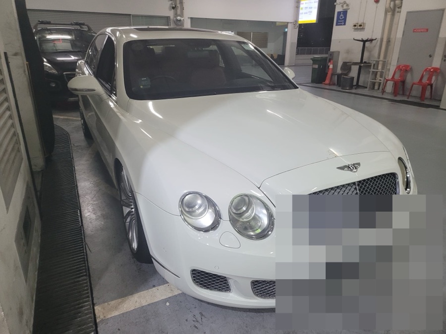 White Bentley Flying Spur in for servicing at our Singapore workshop