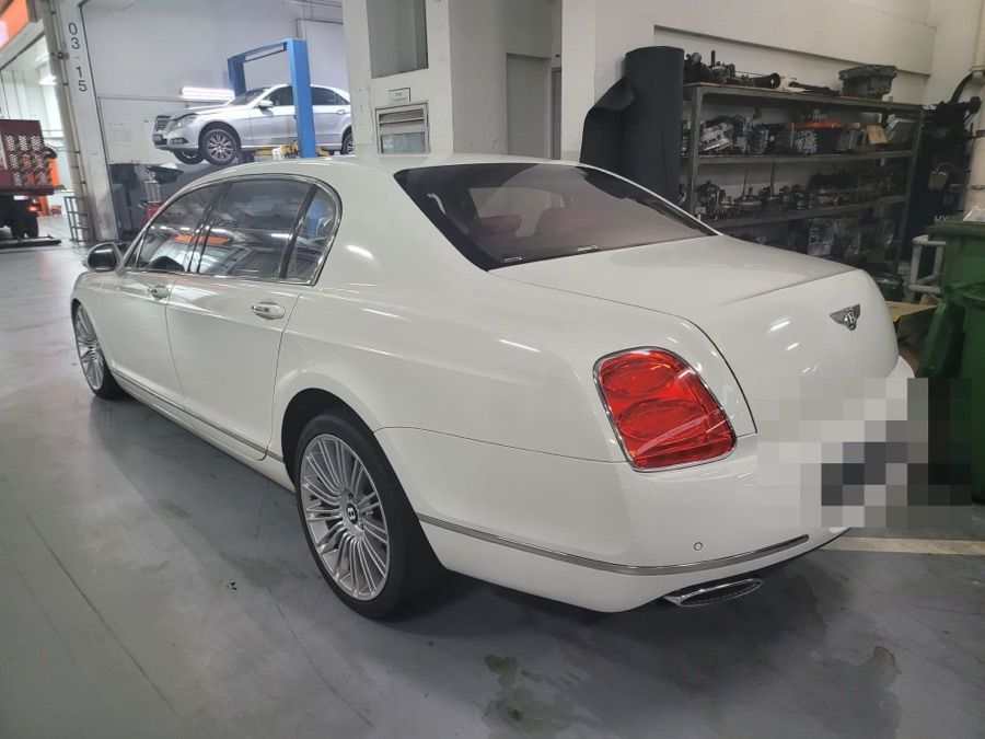 White Bentley Flying Spur in for repair at our Singapore workshop