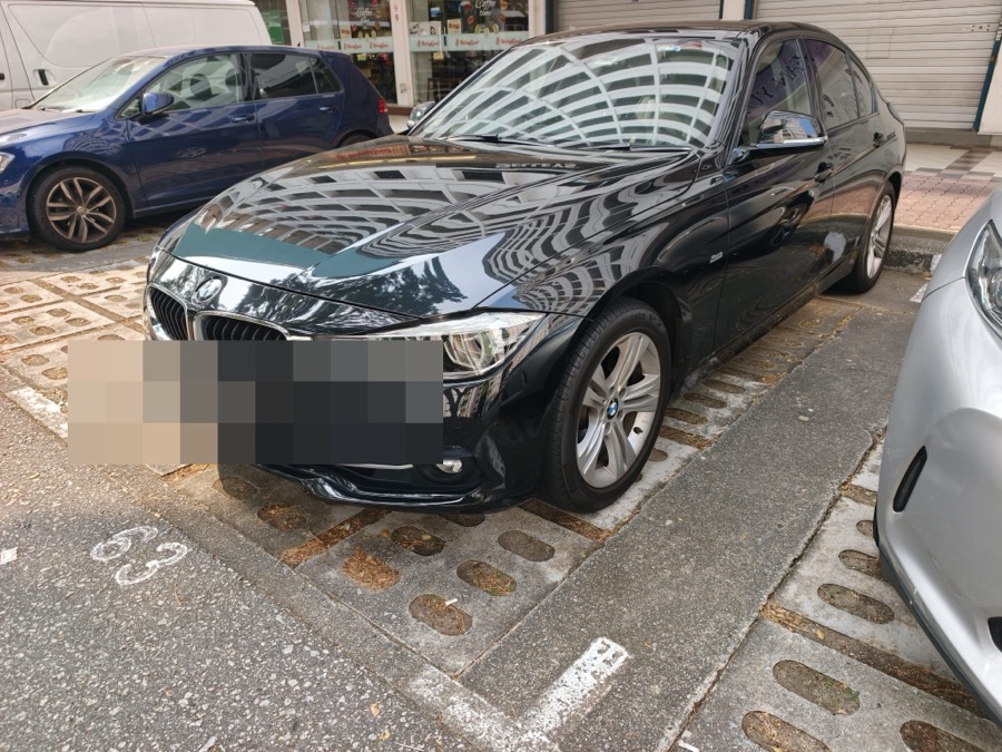 BMW 3 Series parked outdoors