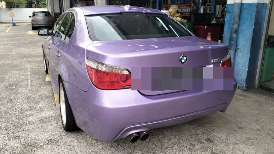 Purple BMW 5 Series sedan parked at our Singapore workshop