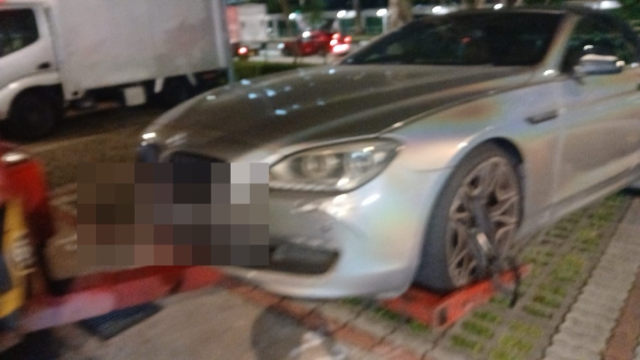 BMW 6 Series convertible parked outdoors