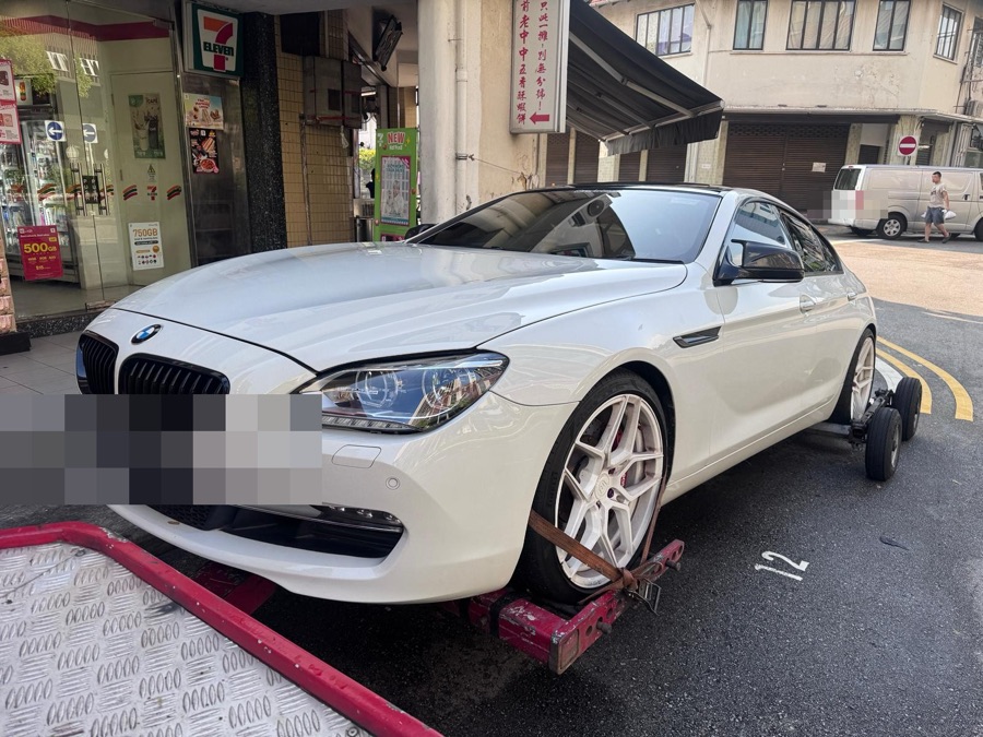 BMW 6 Series Gran Coupe being transported for servicing at our Singapore workshop.