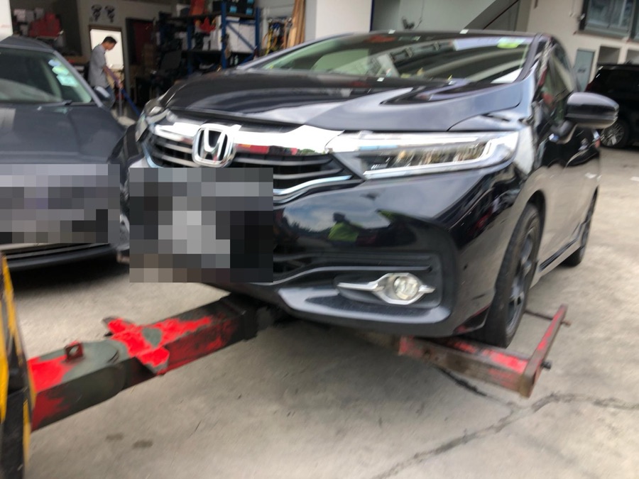 Honda Shuttle towed in for repair at our Singapore workshop