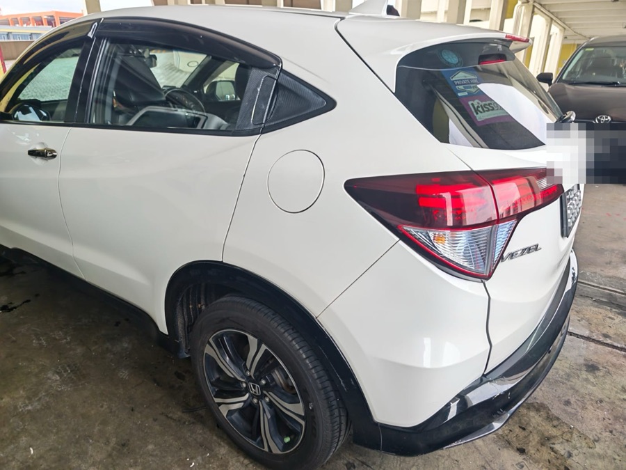 White Honda Vezel SUV parked at our Singapore workshop