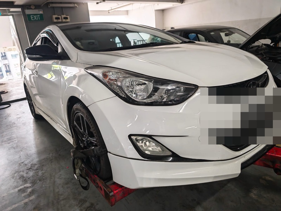Hyundai Elantra raised on a lift at our Singapore workshop