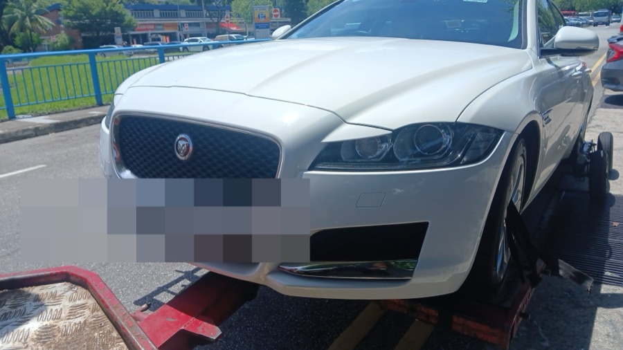 Jaguar XF being transported for servicing at our Singapore workshop.