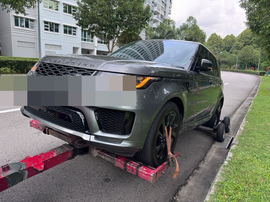Range Rover Sport being towed in for servicing at our Singapore workshop