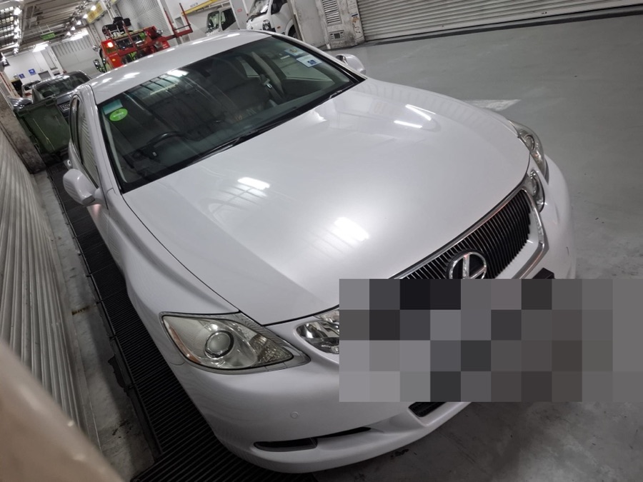 White Lexus GS sedan parked at our Singapore workshop