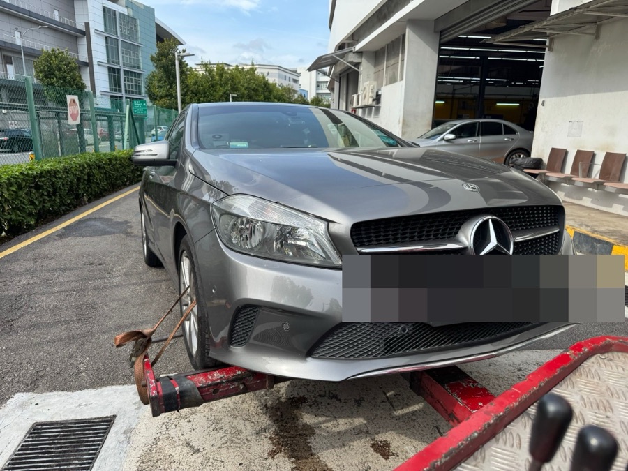Mercedes-Benz A-Class being transported by flatbed tow truck