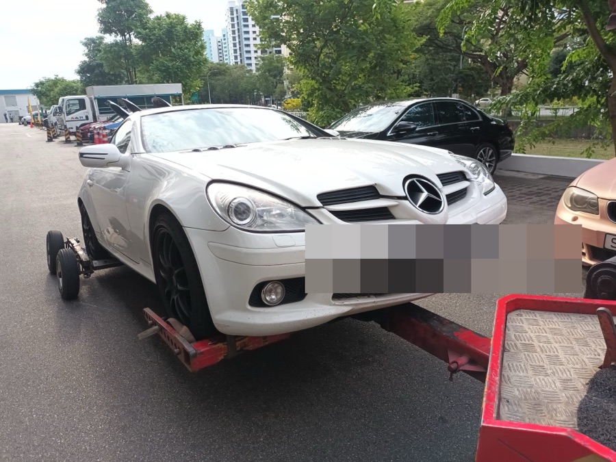 Mercedes-Benz SLK arriving at our Singapore workshop by tow truck