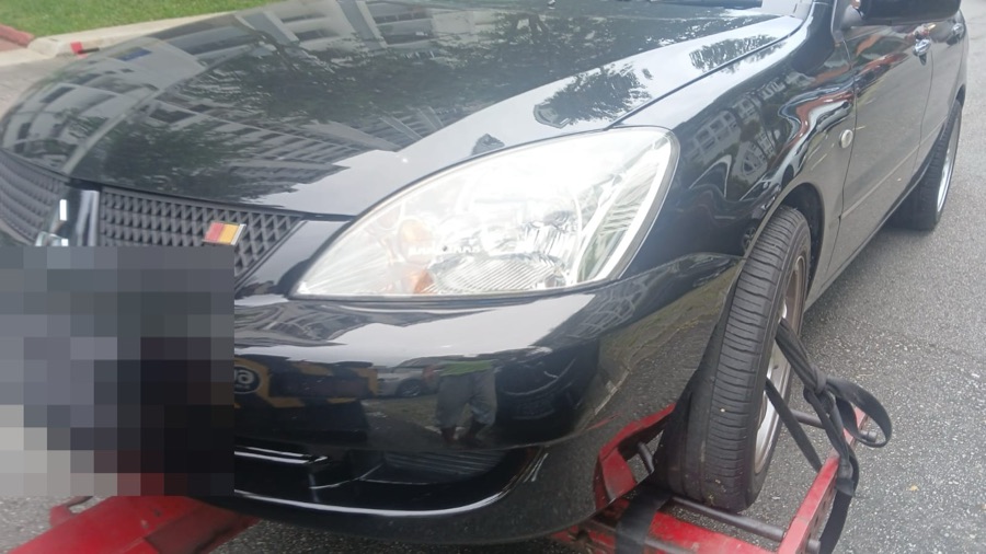 Mitsubishi Lancer towed in for servicing at our Singapore workshop