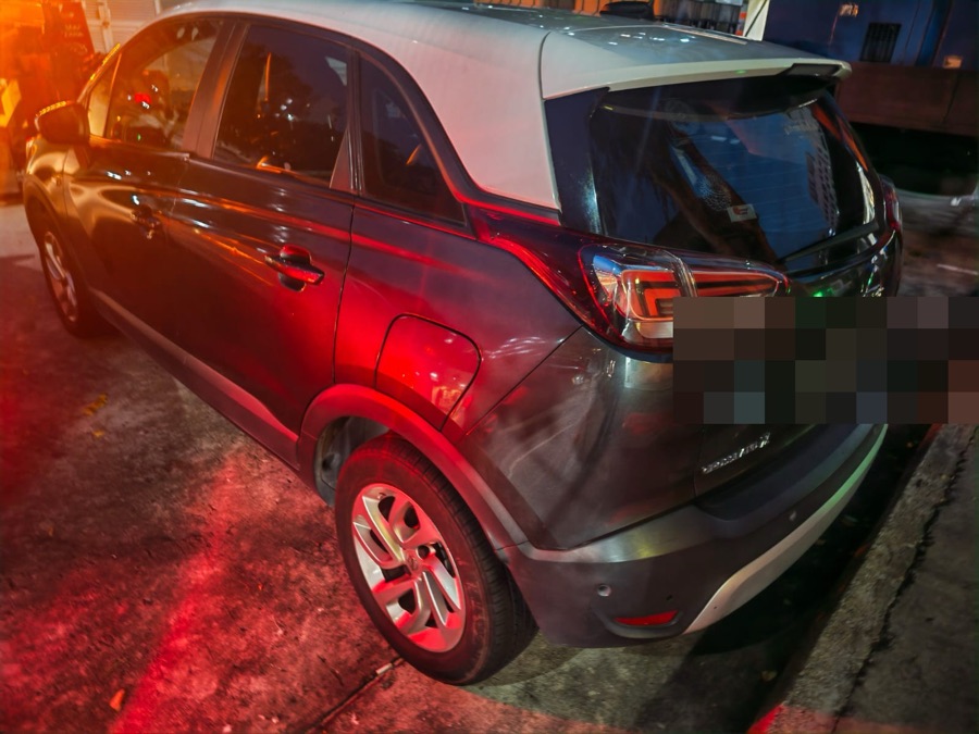 Dark grey Opel Crossland SUV parked on a street