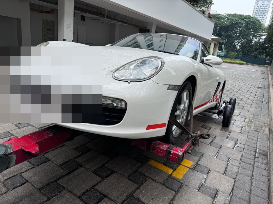Porsche Boxster being towed in for servicing at our Singapore workshop