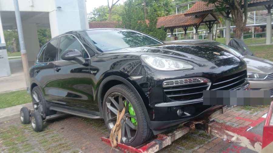 Porsche Cayenne being towed in for workshop service