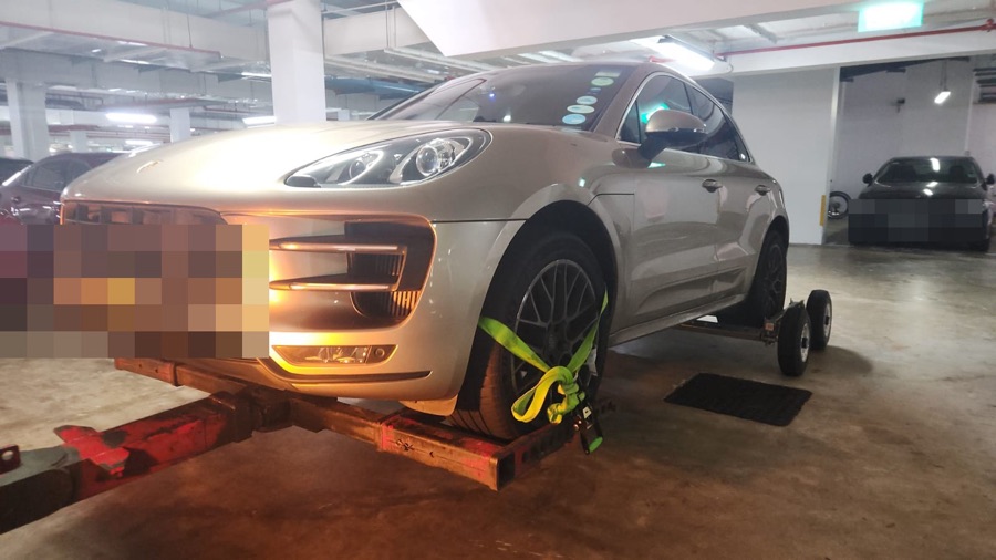Porsche Macan towed in for servicing at our Singapore workshop