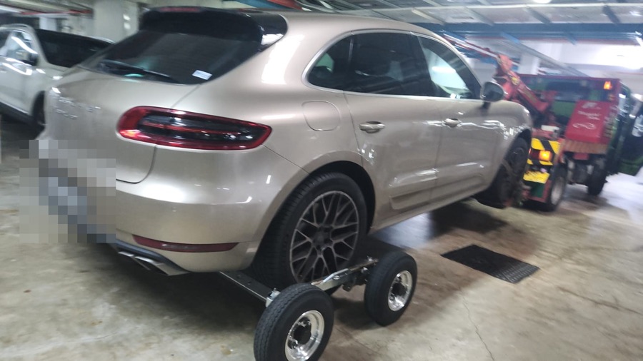 Porsche Macan towed in for servicing at our Singapore workshop