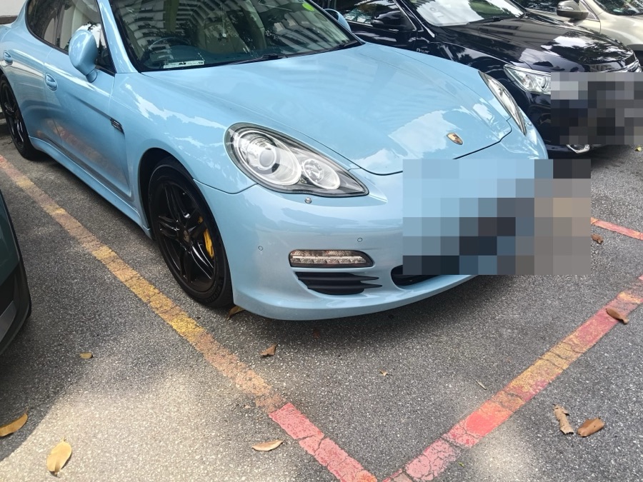 Porsche Panamera parked outdoors, front view