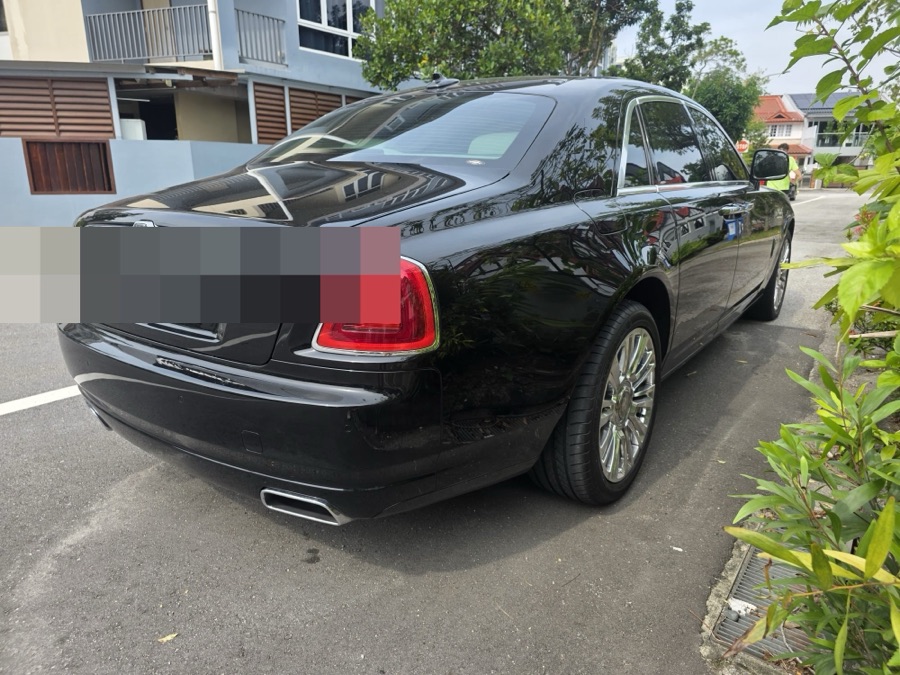 Rolls-Royce Ghost sedan parked on a street