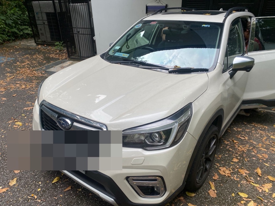 Subaru Forester outside a customer's home before towing
