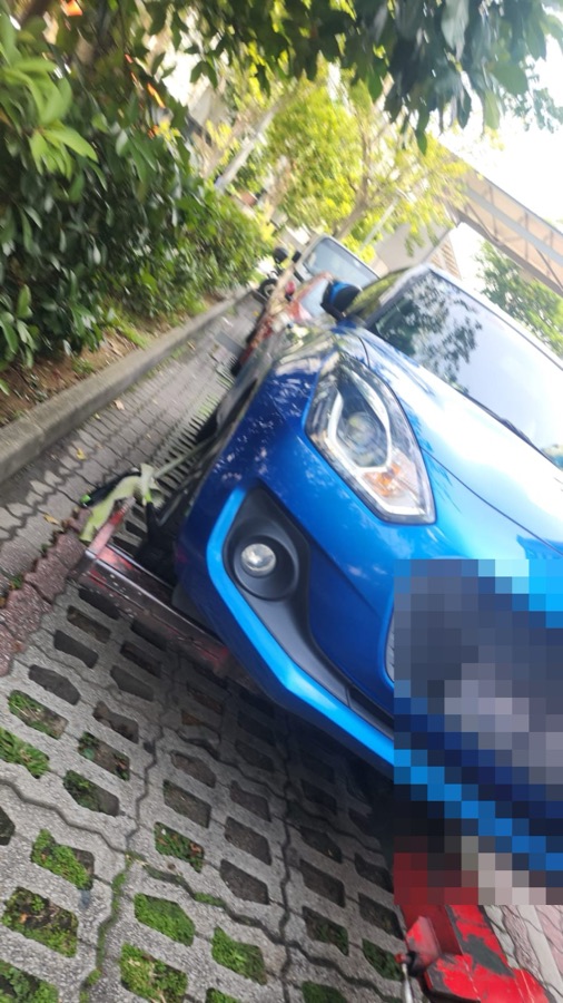 Suzuki Swift towed in for servicing at our Singapore workshop