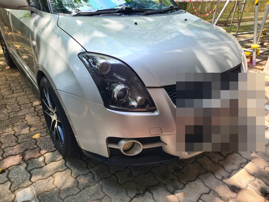 Suzuki Swift hatchback with a sports bodykit, front view, parked outdoors