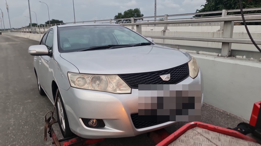 Toyota Allion arriving at our Singapore workshop by tow truck