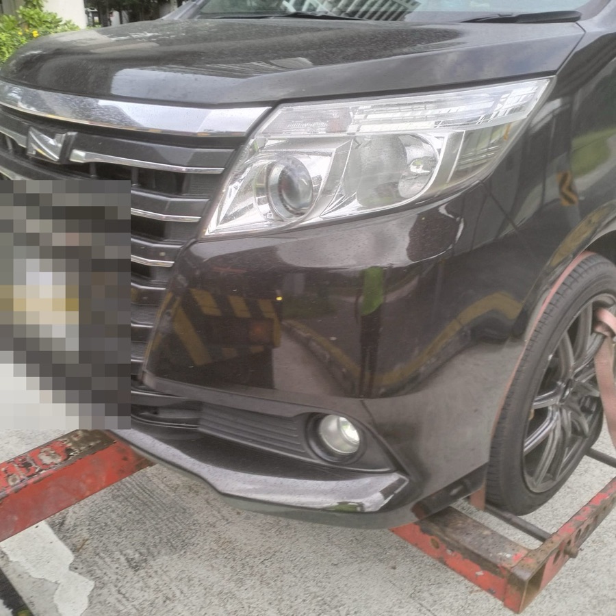 Toyota Noah towed in for servicing at our Singapore workshop