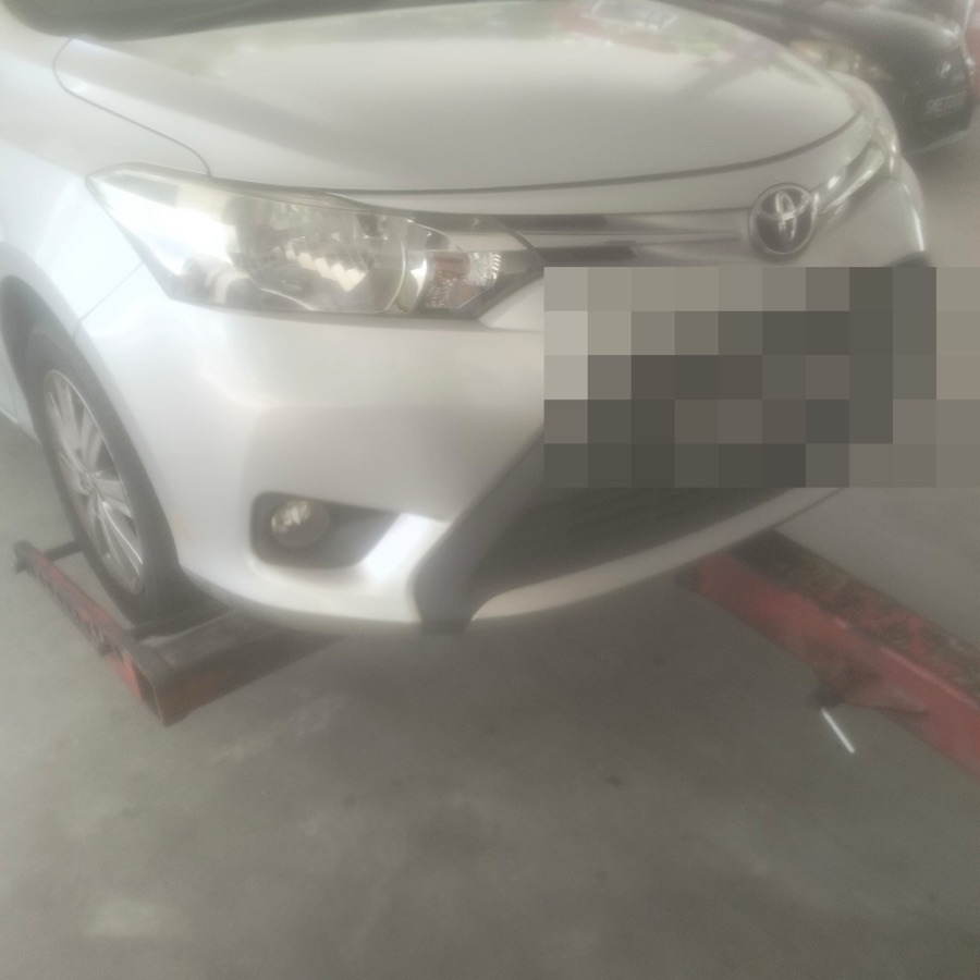 Toyota Vios being towed in for workshop service