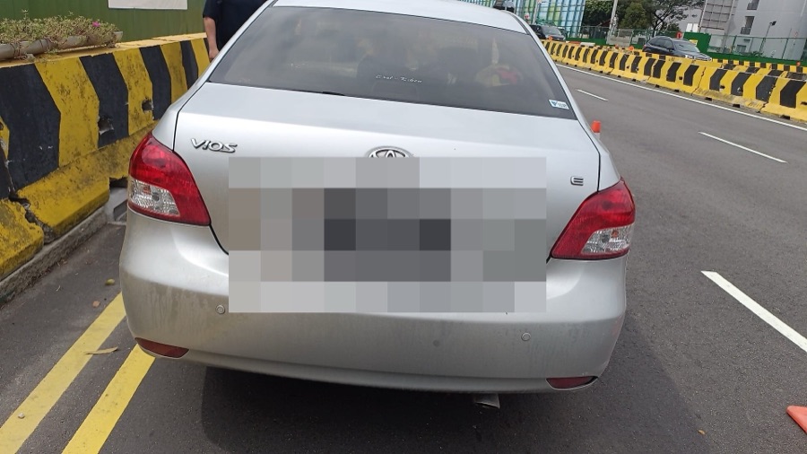 Silver Toyota Vios sedan parked on a street