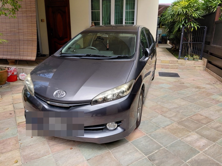 Toyota Wish MPV outside a customer's home before towing