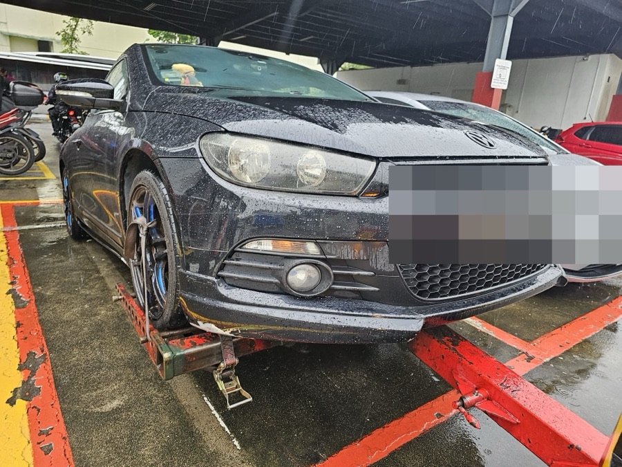 Volkswagen Scirocco arriving by tow truck at our Singapore workshop